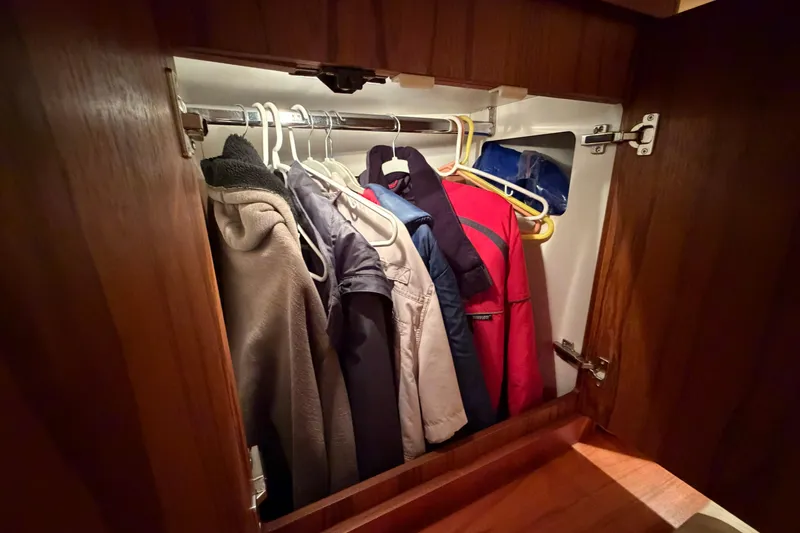 Slide: The Image of Closet with jackets inside a 2004 Tiara Yachts 3200 Open boat. - 28