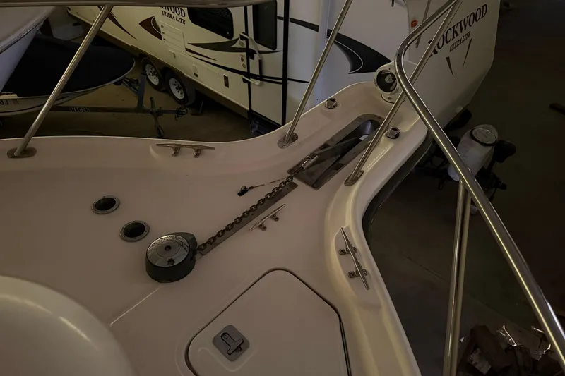 Slide: The Image of Bow of 2004 Tiara Yachts 3200 Open with anchor chain and railing. - 30