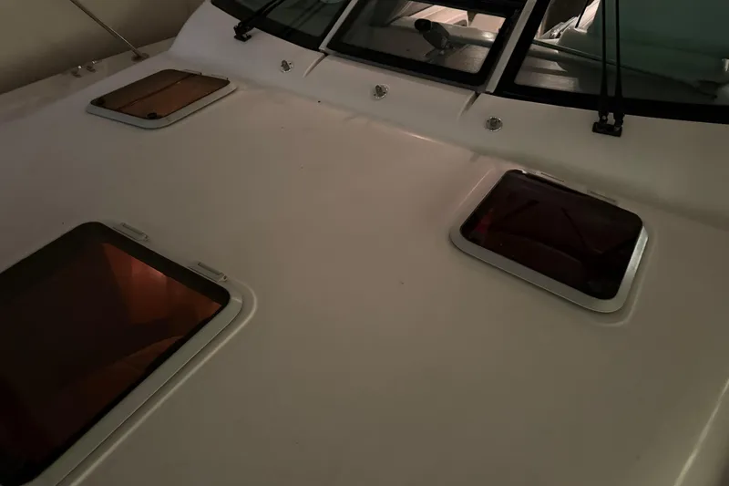 Slide: The Image of 2004 Tiara Yachts 3200 Open deck with hatches and windows. - 31