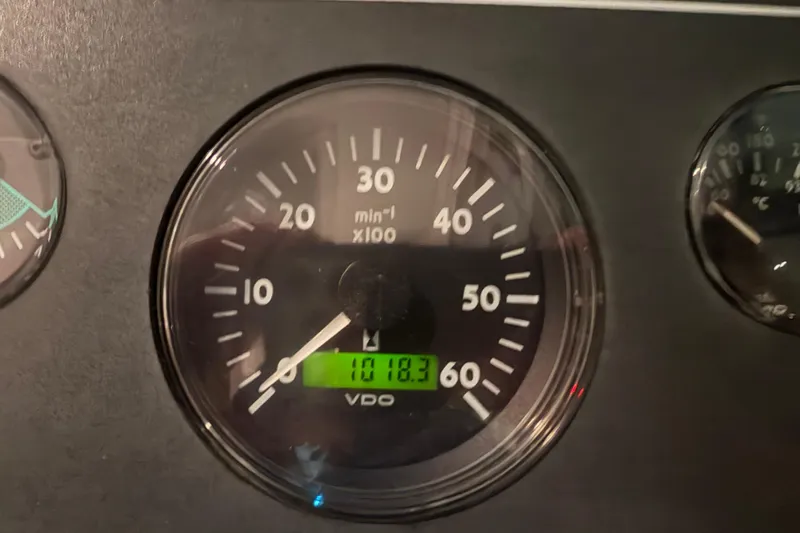 Slide: The Image of Close-up of a 2004 Tiara Yachts 3200 Open tachometer displaying 1018.3 hours. - 5