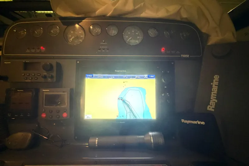Slide: The Image of Dashboard of a 2004 Tiara Yachts 3200 Open with Raymarine navigation system. - 8