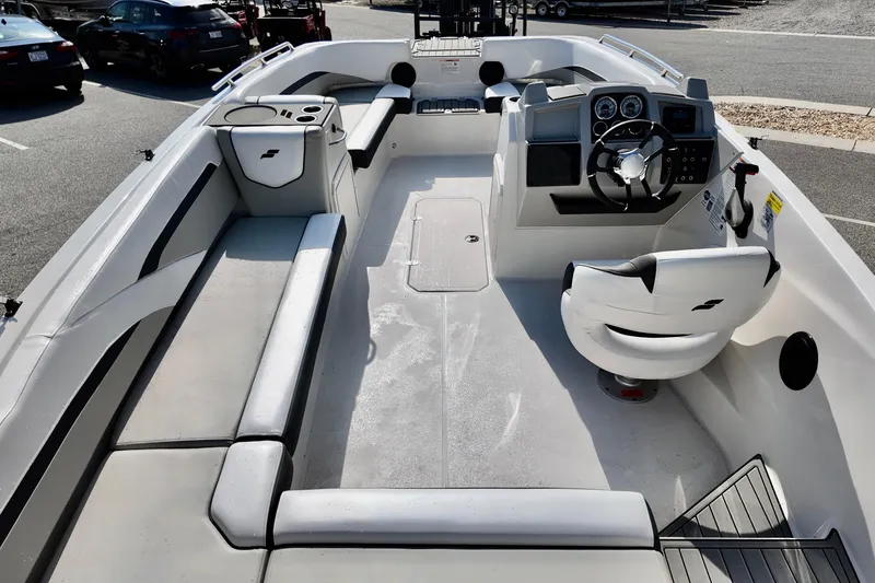Slide: The Image of 2026 Starcraft SVX 211 OB boat interior with seating, steering wheel, and control panel. - 6