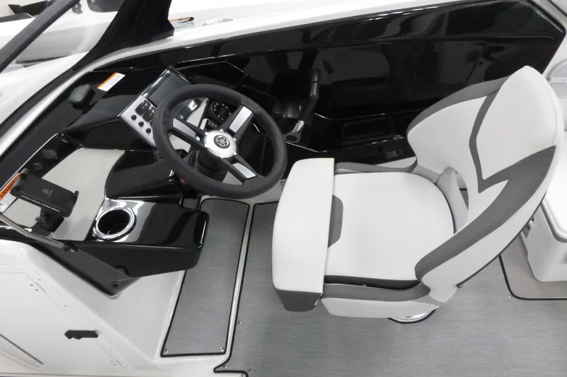 Slide: The Image of 2026 Yamaha Boats AR220 cockpit with sleek steering wheel and modern seating. - 12