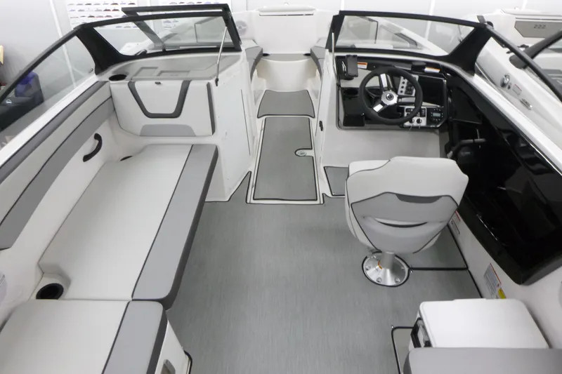 Slide: The Image of 2026 Yamaha Boats AR220 interior with sleek seating and modern helm design. - 5