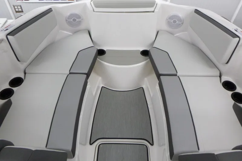 Slide: The Image of 2026 Yamaha Boats AR220 interior with gray seating and cup holders. - 7