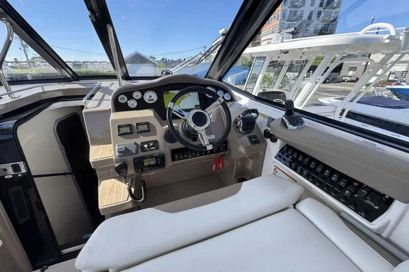 Slide: The Image of Cockpit of 2016 Regal 35 Sport Coupe with modern controls and navigation system. - 14