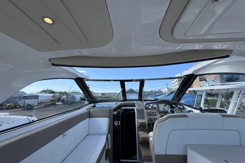 Slide: The Image of Interior view of a 2016 Regal 35 Sport Coupe yacht cockpit. - 23