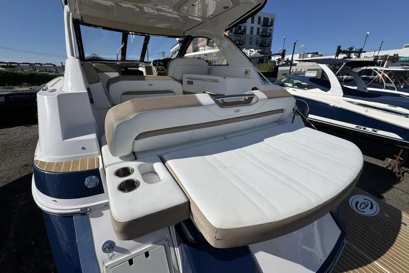 Slide: The Image of 2016 Regal 35 Sport Coupe boat with spacious seating and modern design. - 7