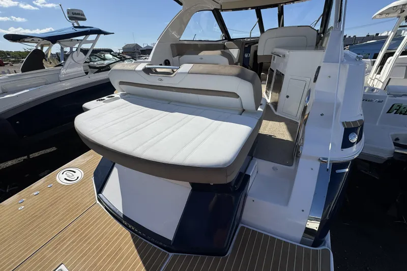 Slide: The Image of 2016 Regal 35 Sport Coupe boat with spacious rear seating and sleek design. - 8