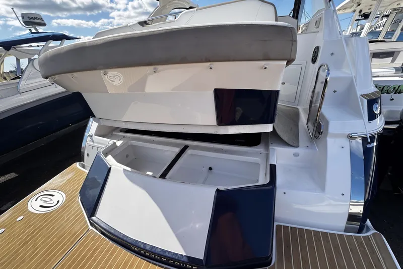 Slide: The Image of 2016 Regal 35 Sport Coupe boat with open storage compartments on deck. - 9