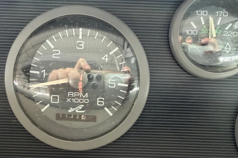 Slide: The Image of Close-up of 1994 Sea Ray Sundancer 330 RPM and temperature gauges. - 14