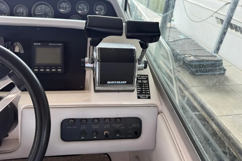 Slide: The Image of 1994 Sea Ray Sundancer 330 helm with Quicksilver throttle controls and instrument panel. - 16