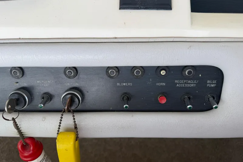 Slide: The Image of Control panel of a 1994 Sea Ray Sundancer 330 boat with ignition and accessory switches. - 18