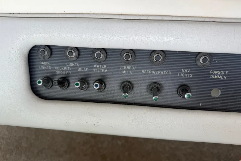 Slide: The Image of Control panel of a 1994 Sea Ray Sundancer 330 boat with labeled switches. - 19