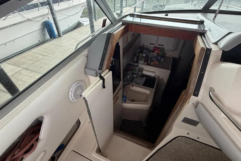 Slide: The Image of Interior view of 1994 Sea Ray Sundancer 330 boat, showing compact kitchen area. - 22