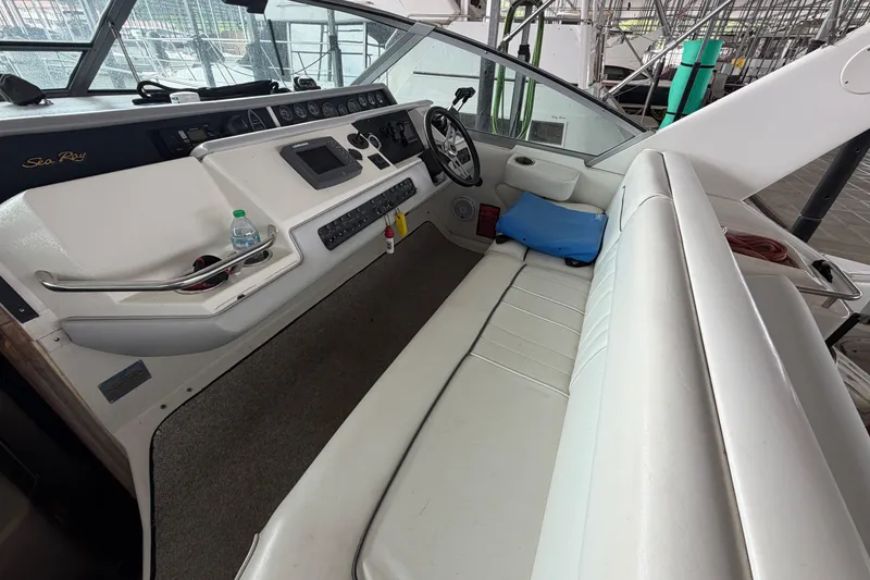 Slide: The Image of Interior cockpit of 1994 Sea Ray Sundancer 330 with steering wheel and seating. - 23