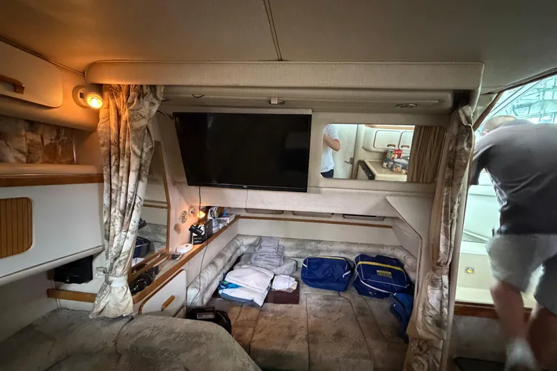 Slide: The Image of Interior of a 1994 Sea Ray Sundancer 330 yacht with cozy seating and modern amenities. - 31