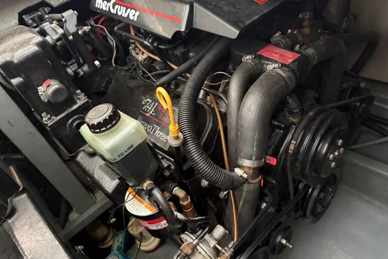 Slide: The Image of Engine compartment of a 1994 Sea Ray Sundancer 330 with MerCruiser components. - 36
