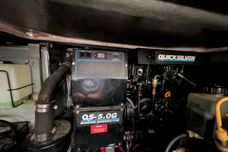 Slide: The Image of Engine room of 1994 Sea Ray Sundancer 330 with Quicksilver marine generator. - 39