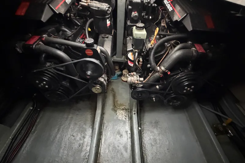 Slide: The Image of Engine compartment of a 1994 Sea Ray Sundancer 330, showcasing dual engines and components. - 40
