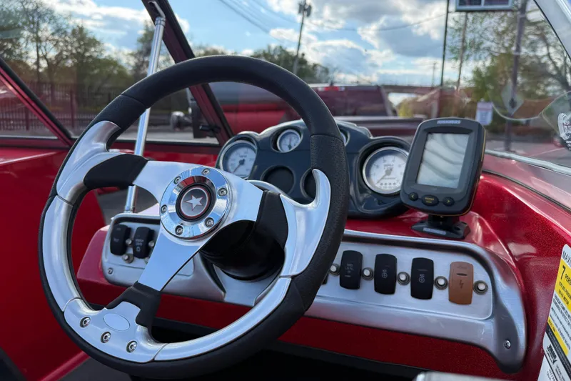 Slide: The Image of Steering wheel and dashboard of 2013 Stratos 486 Ski-N-Fish boat. - 14