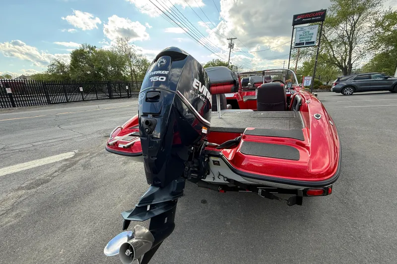 Slide: The Image of Red 2013 Stratos 486 Ski-N-Fish boat with Evinrude 150 engine in parking lot. - 18