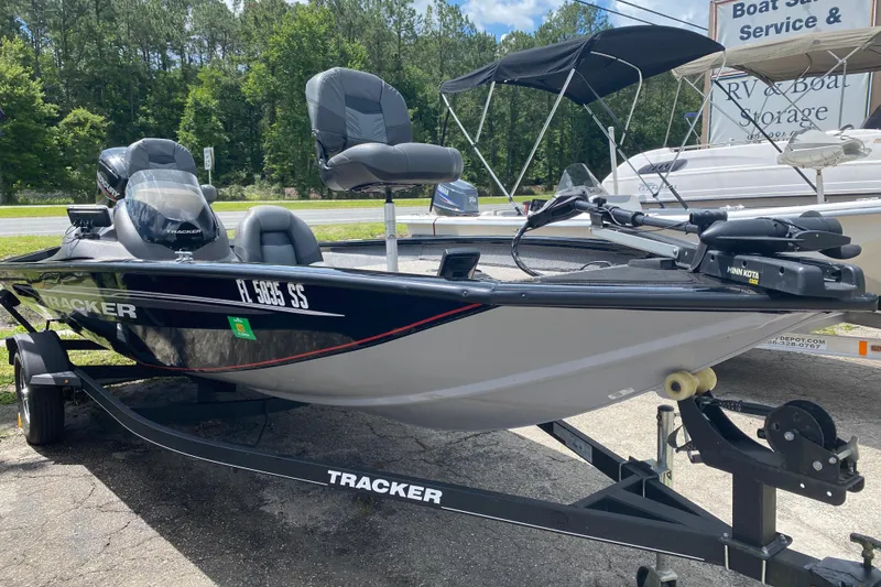 The Image of 2020 Tracker Pro Team 175 TXW boat on trailer, parked outdoors. - 1
