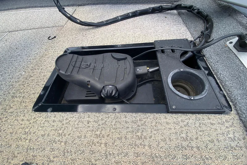 Slide: The Image of 2020 Tracker Pro Team 175 TXW boat foot pedal and wiring on carpeted deck. - 11