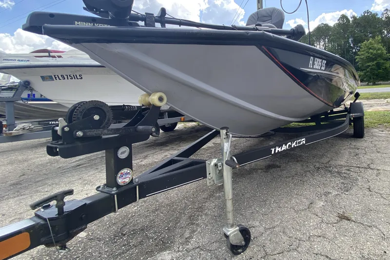 Slide: The Image of 2020 Tracker Pro Team 175 TXW boat on trailer, parked outdoors. - 13