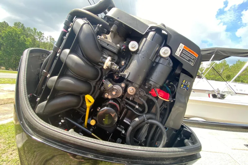 Slide: The Image of 2020 Tracker Pro Team 175 TXW boat engine close-up, showcasing intricate mechanical components. - 17