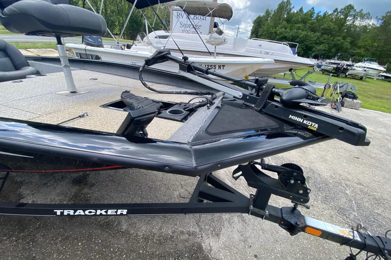 Slide: The Image of 2020 Tracker Pro Team 175 TXW boat with Minn Kota trolling motor on trailer. - 7