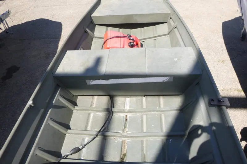 Slide: The Image of 2014 Polar Kraft Jon MV 1448 LW boat interior with fuel tank, shadowed view. - 3