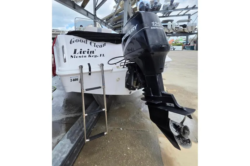 Slide: The Image of 2001 Pro-Line 19 Sport boat with Mercury 125 outboard motor, docked in Siesta Key, FL. - 2