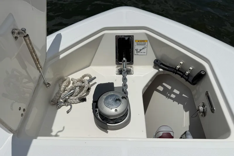 Slide: The Image of Anchor compartment of 2020 Boston Whaler 330 Outrage with rope and chain. - 11