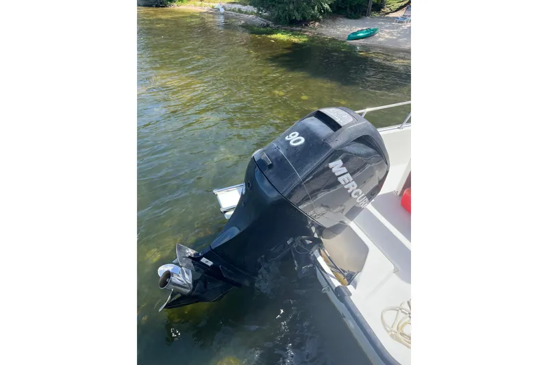 Slide: The Image of Boston Whaler 170 Montauk 2010 with Mercury 90 outboard motor on water. - 3