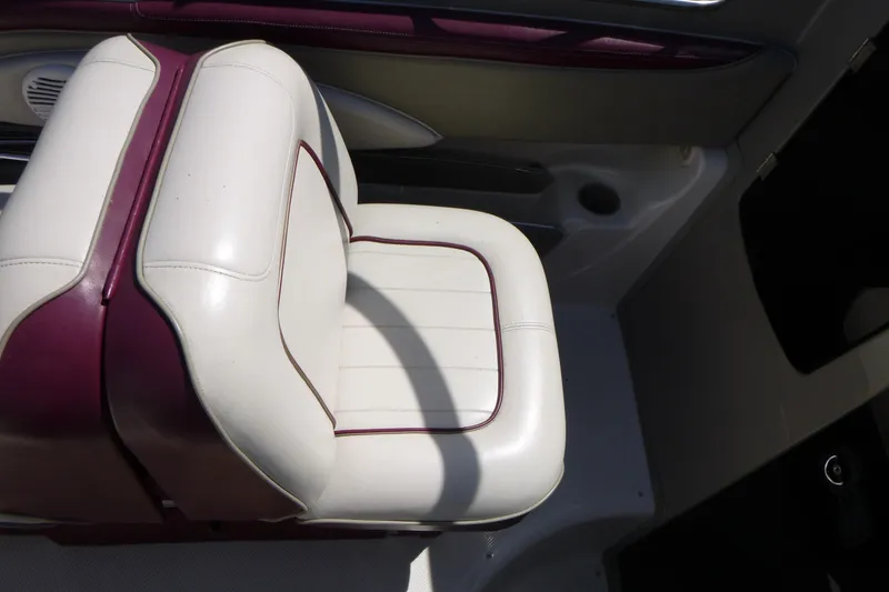 Slide: The Image of White and maroon seat in 1998 Maxum 2300 SC boat interior. - 10