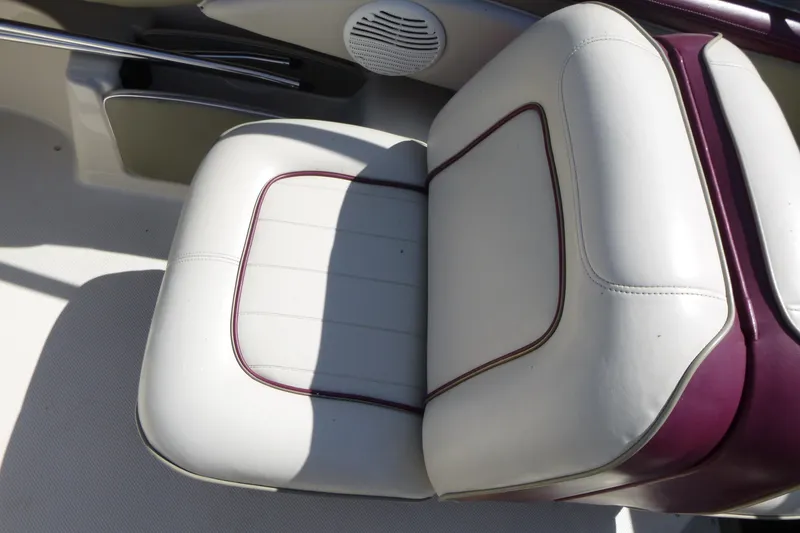 Slide: The Image of White and maroon boat seat in a 1998 Maxum 2300 SC. - 11