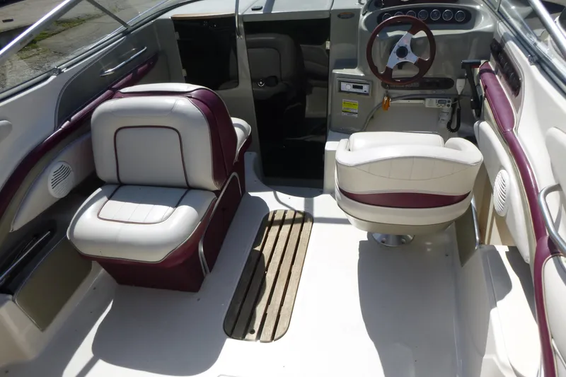 Slide: The Image of Interior of a 1998 Maxum 2300 SC boat with white and maroon seating. - 6