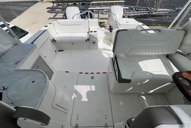 Slide: The Image of 2023 World Cat 325 DC boat interior with spacious seating and modern design. - 7