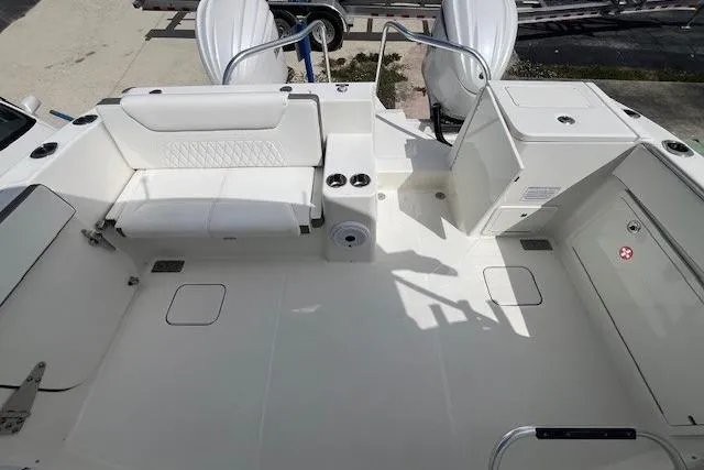 Slide: The Image of 2023 World Cat 325 DC boat interior with seating and storage compartments. - 8