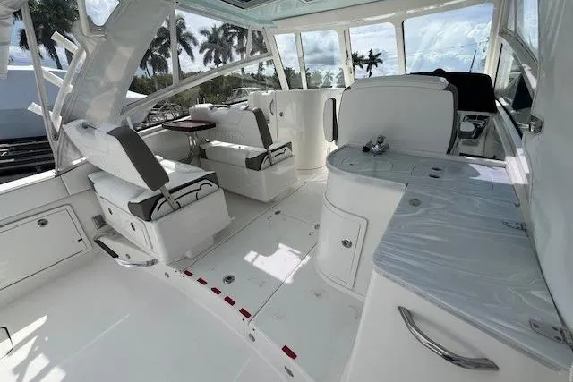 Slide: The Image of Interior of 2023 World Cat 325 DC boat with seating and helm station. - 9