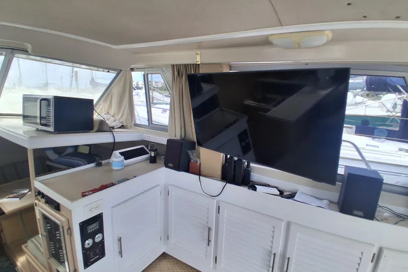 Slide: The Image of Interior of 1986 Silverton 34 Convertible yacht with TV and microwave. - 12