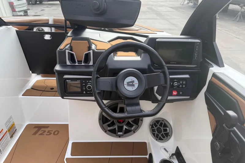 Slide: The Image of 2022 Axis T250 boat dashboard with steering wheel, controls, and display screen. - 10