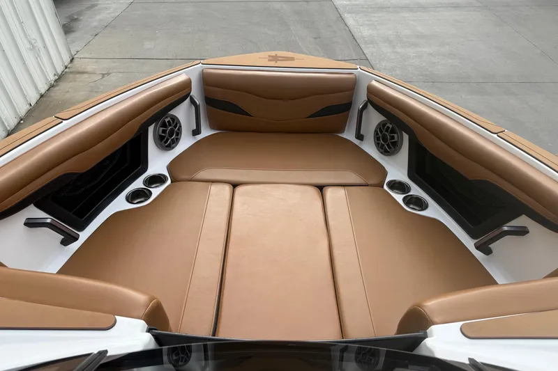 Slide: The Image of Luxurious interior of 2022 Axis T250 boat with tan leather seating and cup holders. - 11