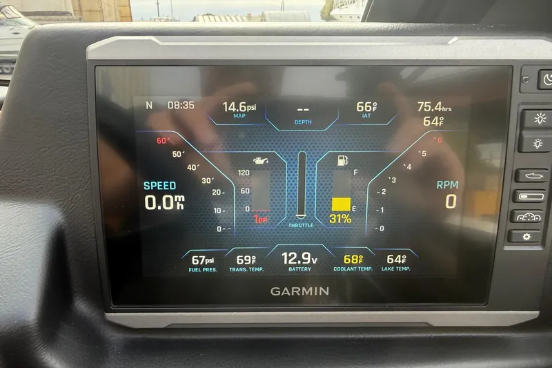 Slide: The Image of Garmin display in 2022 Axis T250 showing speed, RPM, and various engine metrics. - 15