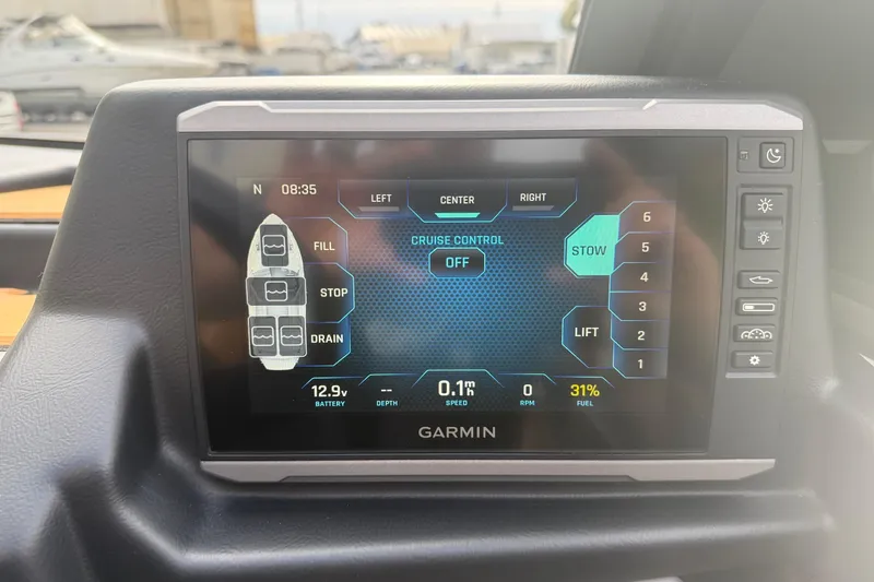 Slide: The Image of Garmin display in 2022 Axis T250 boat showing cruise control and fuel status. - 16