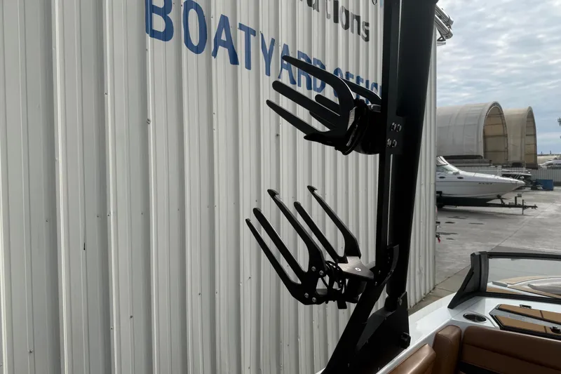 Slide: The Image of 2022 Axis T250 boat with wakeboard rack near boatyard office. - 20