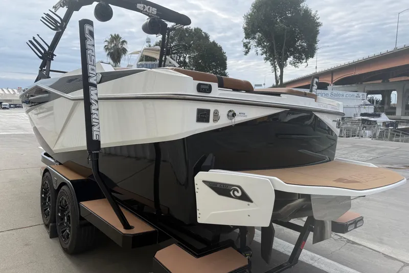 Slide: The Image of 2022 Axis T250 boat on trailer, featuring sleek design and modern accessories. - 4