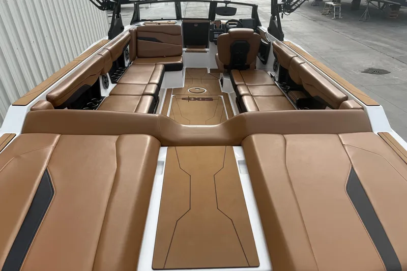 Slide: The Image of 2022 Axis T250 boat interior with tan leather seating and sleek design. - 7
