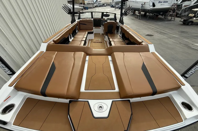 Slide: The Image of 2022 Axis T250 boat interior with tan seating and sleek design. - 8